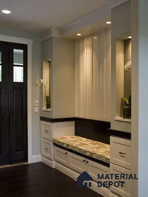 A kitchen with marble counter tops and stainless steel appliances on the wall, along with hanging lights hanging from the ceiling over the ceiling in front of a wooden counter top of a kitchen counter top space next to